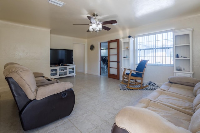 living room with french doors and ceiling fan