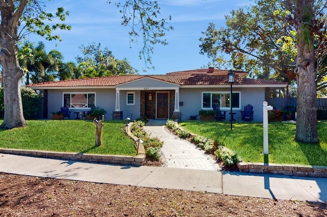 ranch-style home with a front yard