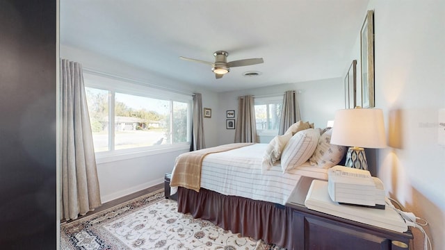 bedroom with ceiling fan and light wood-type flooring