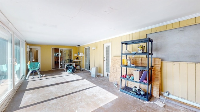 interior space featuring crown molding and radiator heating unit