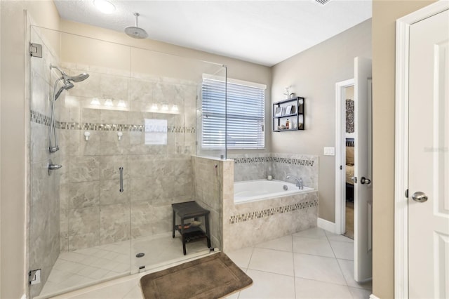 bathroom with independent shower and bath and tile patterned flooring