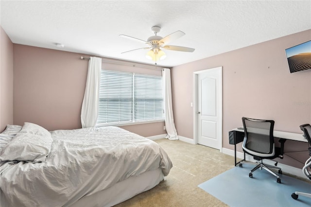 bedroom featuring ceiling fan and light colored carpet