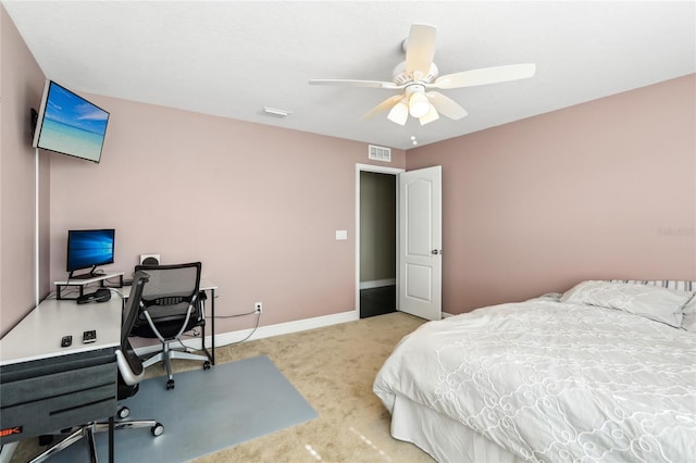 bedroom featuring ceiling fan and light carpet