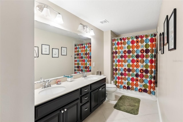 full bathroom with toilet, tile patterned floors, vanity, and shower / tub combo