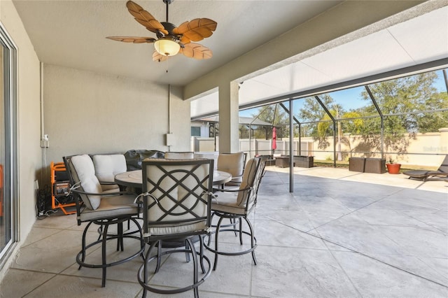 exterior space featuring ceiling fan and a lanai