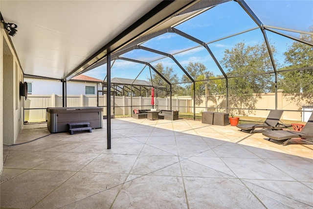 view of patio featuring a lanai, an outdoor hangout area, and a hot tub