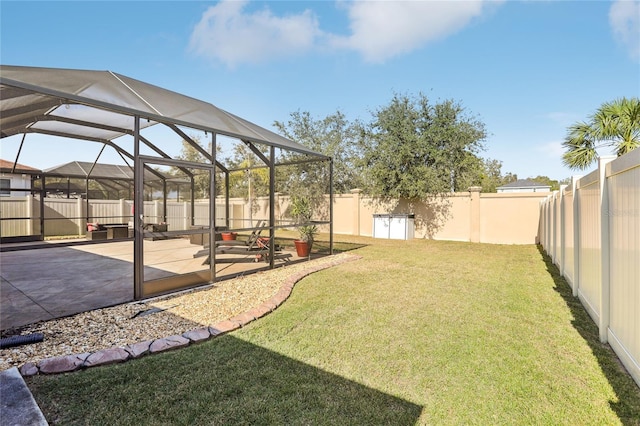 view of yard featuring a lanai and a patio