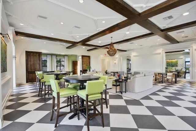 dining room featuring a wealth of natural light and beam ceiling