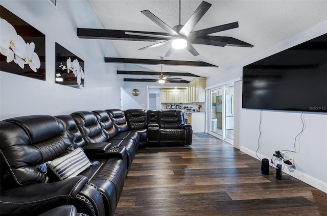 living room with vaulted ceiling with beams, wood-type flooring, and a textured ceiling