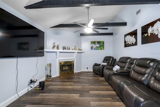 living room featuring ceiling fan, dark hardwood / wood-style floors, a textured ceiling, and vaulted ceiling