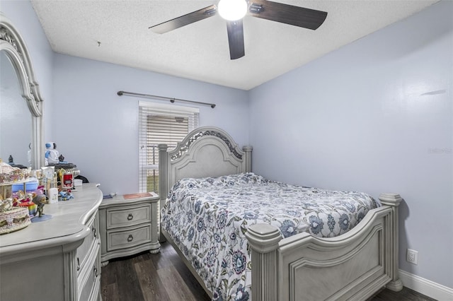 bedroom featuring a textured ceiling, dark hardwood / wood-style floors, and ceiling fan