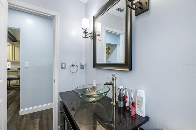 bathroom featuring hardwood / wood-style floors and vanity