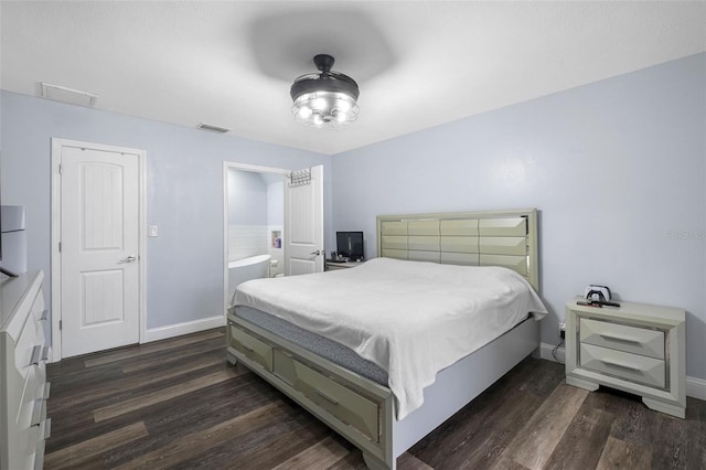 bedroom featuring dark hardwood / wood-style flooring