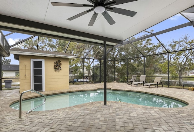 view of swimming pool with a lanai, a patio area, and ceiling fan