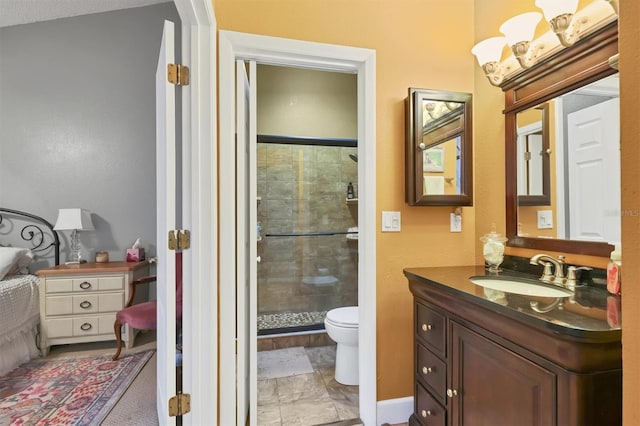 bathroom with walk in shower, vanity, and toilet