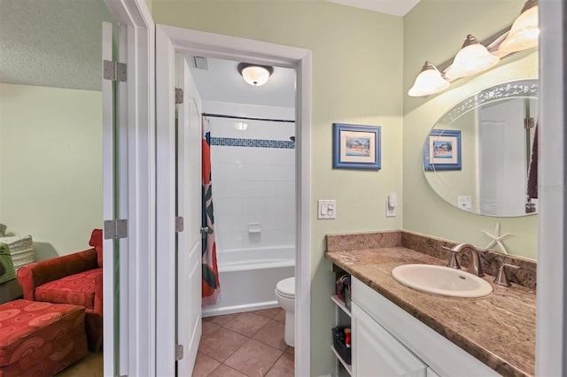 full bathroom with tile patterned floors, vanity, toilet, and shower / bath combination with curtain