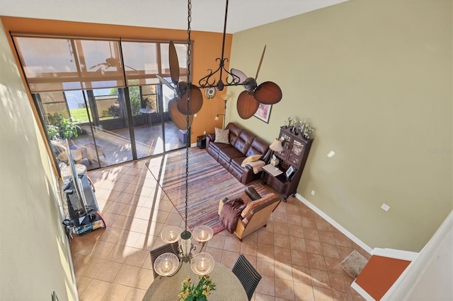 dining room featuring light tile patterned floors and a notable chandelier