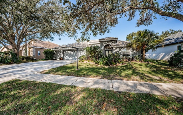 view of front of home featuring a garage and a front lawn