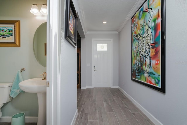16819 Shell Bay Dr, Land O Lakes, FL 34638 - corridor with wood tiled floors, crown molding, baseboards, and recessed lighting