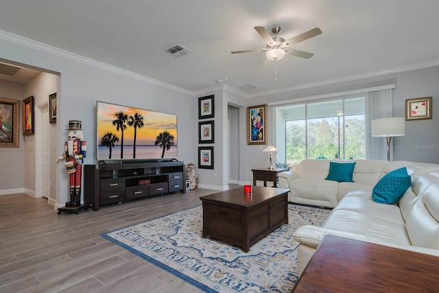 16819 Shell Bay Dr, Land O Lakes, FL 34638 - living area with baseboards, ornamental molding, a ceiling fan, and wood finished floors