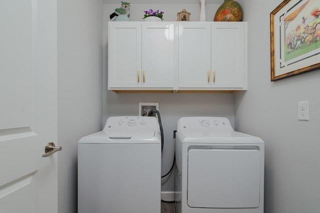 16819 Shell Bay Dr, Land O Lakes, FL 34638 - washroom featuring cabinet space and washer and clothes dryer