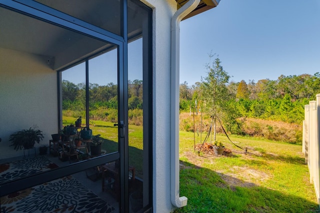 16819 Shell Bay Dr, Land O Lakes, FL 34638 - detailed view of stucco siding and a heavily wooded area