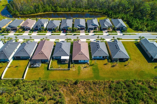16819 Shell Bay Dr, Land O Lakes, FL 34638 - aerial view of residential area featuring a nearby body of water and a forest