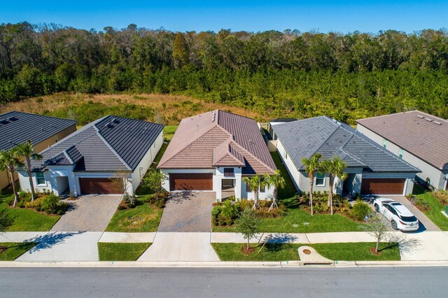16819 Shell Bay Dr, Land O Lakes, FL 34638 - aerial view of property and surrounding area with a forest