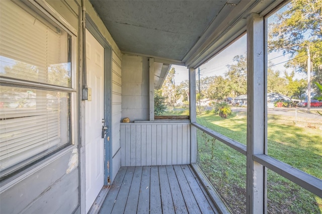 unfurnished sunroom with a wealth of natural light