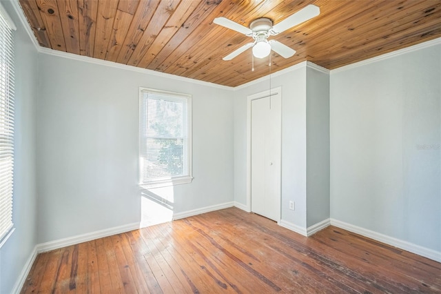 unfurnished bedroom featuring wood-type flooring, ceiling fan, crown molding, and wood ceiling