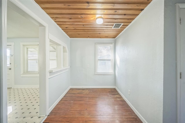 interior space with wood-type flooring, crown molding, and wood ceiling