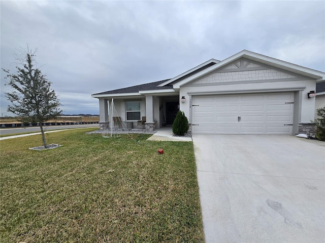 view of front facade featuring a front lawn and a garage