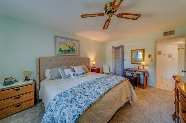 bedroom featuring ceiling fan and light carpet