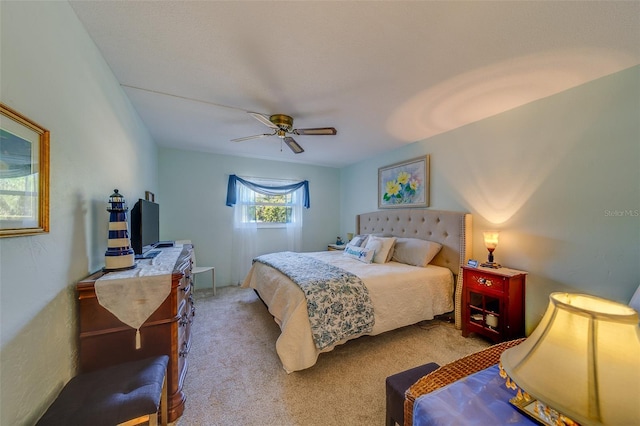 bedroom featuring ceiling fan and light colored carpet