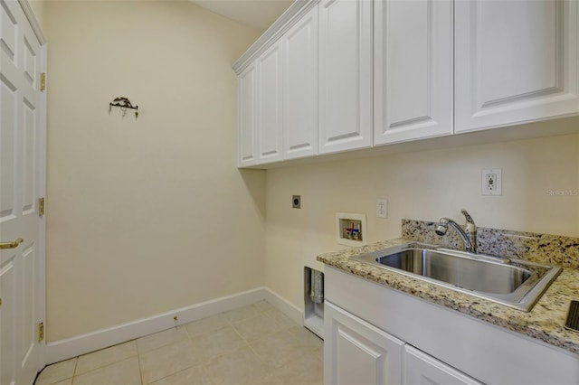 laundry room with electric dryer hookup, cabinets, sink, washer hookup, and light tile patterned flooring