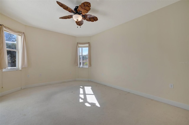 unfurnished room featuring light carpet and ceiling fan