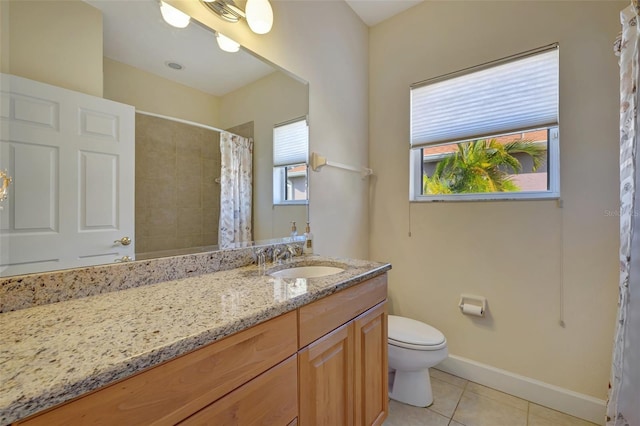 bathroom with tile patterned flooring, vanity, a shower with shower curtain, and toilet