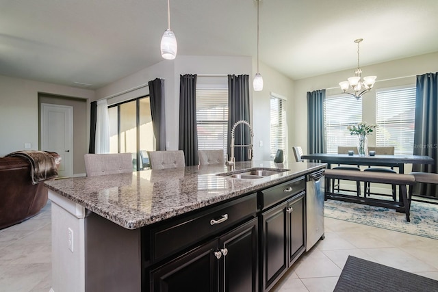 kitchen with dishwasher, pendant lighting, a center island with sink, and sink