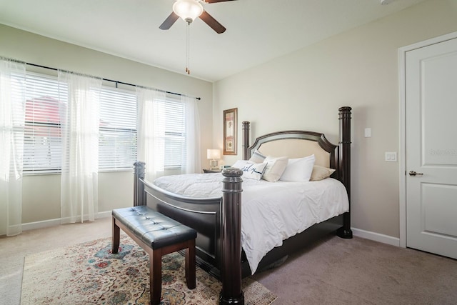 bedroom featuring light colored carpet and ceiling fan