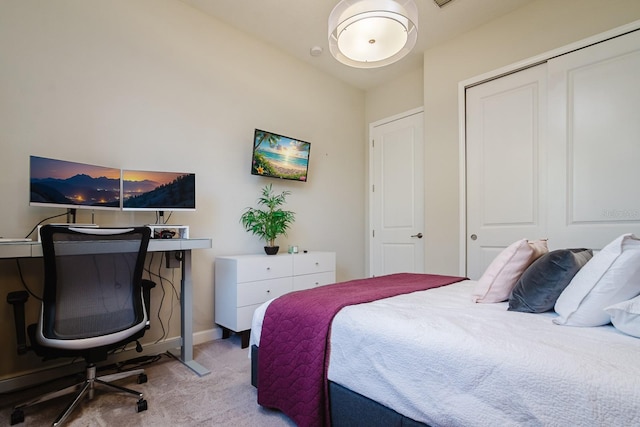 carpeted bedroom featuring a closet