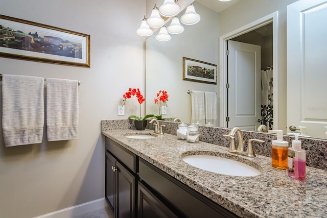 bathroom featuring vanity and an inviting chandelier