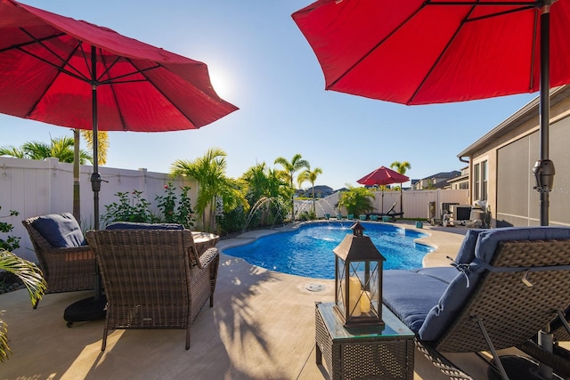 view of swimming pool with a patio area and pool water feature