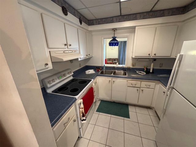 kitchen with white cabinets, white appliances, a drop ceiling, and range hood