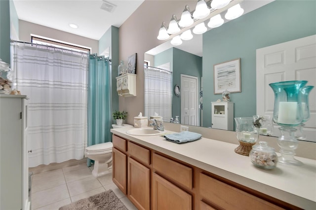 bathroom featuring toilet, vanity, and tile patterned floors