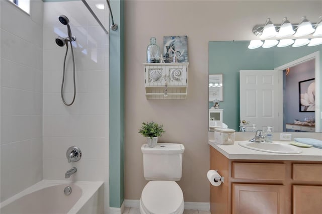 full bathroom featuring tiled shower / bath combo, toilet, and vanity