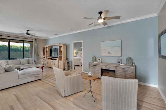 living room with light wood-type flooring, ceiling fan, and ornamental molding