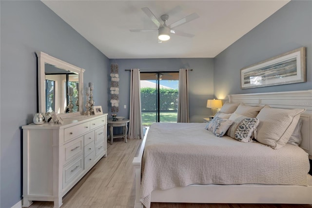 bedroom featuring ceiling fan, light wood-type flooring, and access to outside