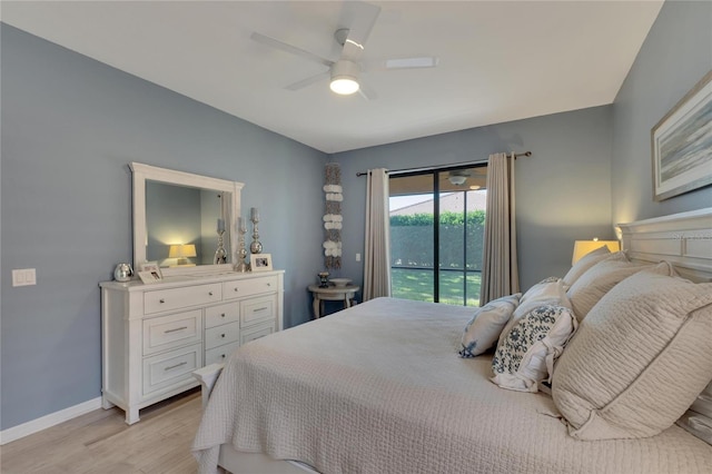 bedroom featuring access to exterior, ceiling fan, and light hardwood / wood-style flooring