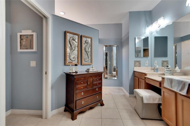 bathroom with tile patterned floors and vanity