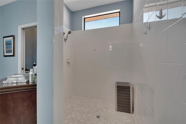 bathroom with tiled shower